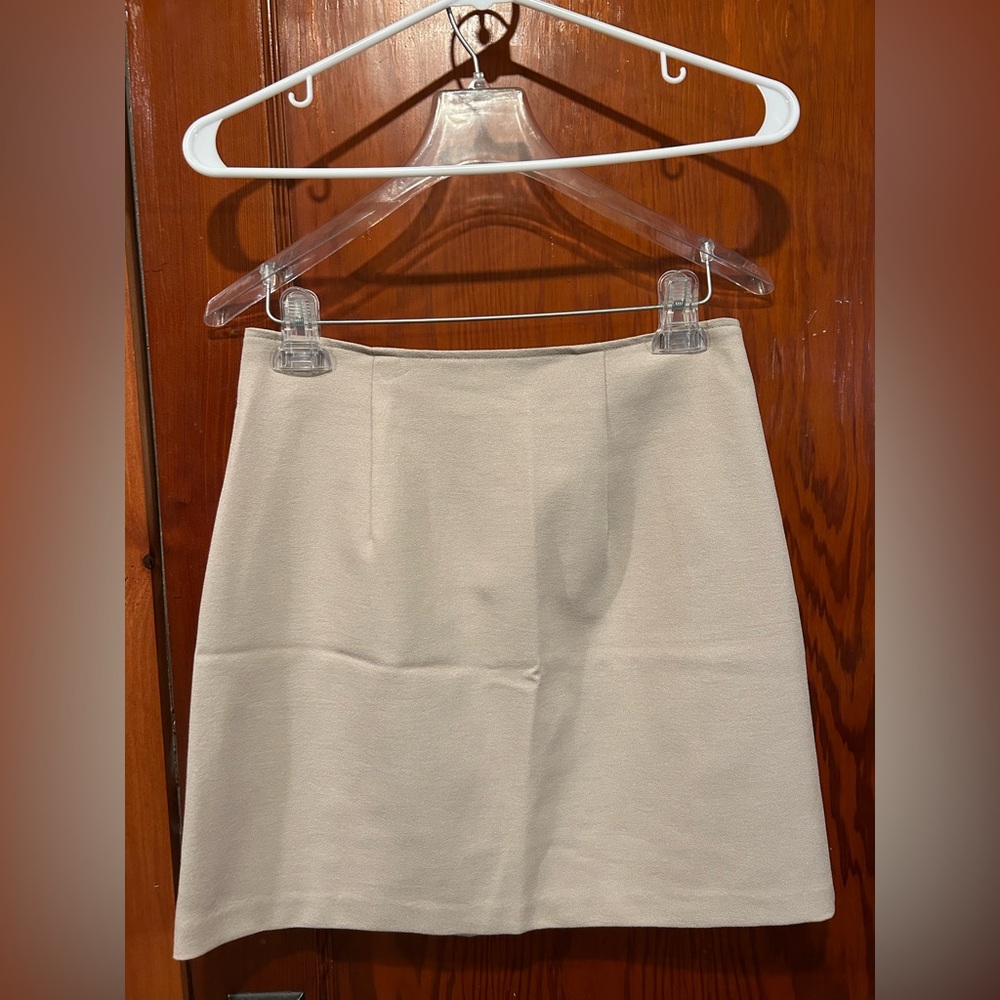 Vintage Y2K xoxo beige high-waisted mini skirt with pleats and zipper closure